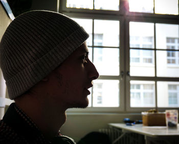 Close-up of young man sitting in office