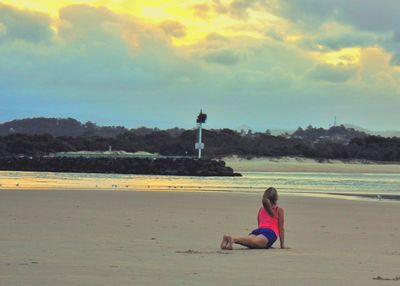 People relaxing on beach