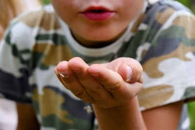 Close-up of boy with hands