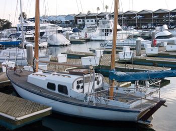 Yachts moored in harbor