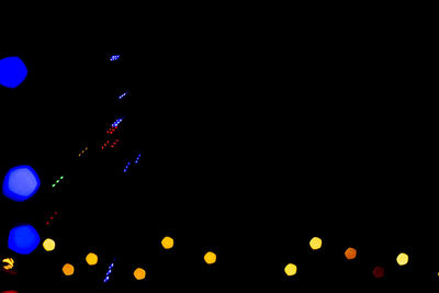 Defocused image of illuminated lights at night