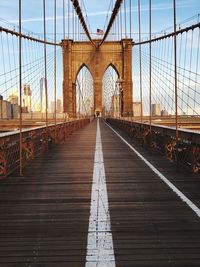 Footpath on brooklyn bridge against sky