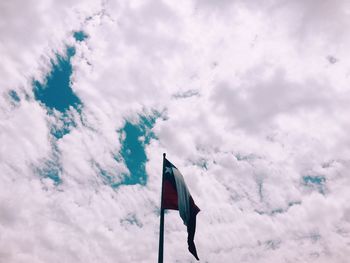 Low angle view of flag against sky