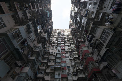 Low angle view of buildings in city against sky