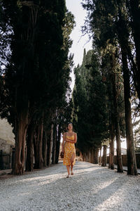 Rear view of woman walking in park