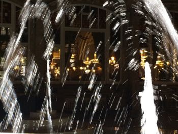 Wet illuminated city at night