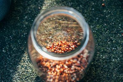 Close-up high angle view of food in jar on road