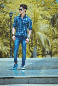 Full length of young man looking away