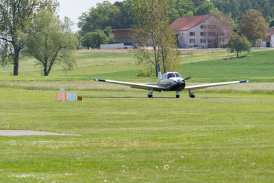 Lommis, switzerland, may 11, 2022 piper pa28-181 archer iii propeller plane on a small airfield