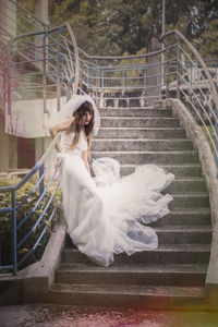 Young woman on staircase