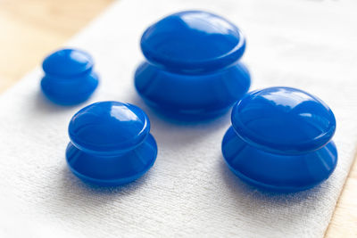 High angle view of blue bottles on table