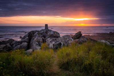 Scenic view of sea against sky during sunset