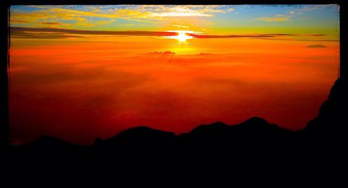 Scenic view of mountains at sunset