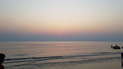 Scenic view of sea against clear sky during sunset