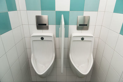 Urinals in public restroom