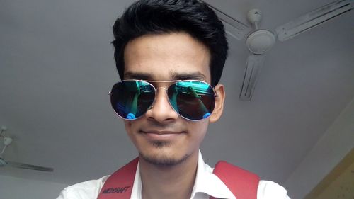 Portrait of young man wearing sunglasses