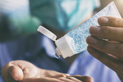 Close-up of man holding hands