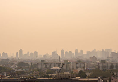 High angle view of buildings against sky during sunset