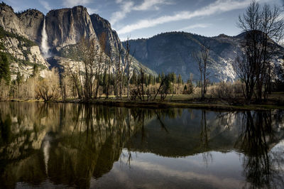 Bridal veil falls reflected in lake in yosemite valley national park california