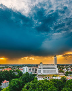 View of buildings in city at sunset