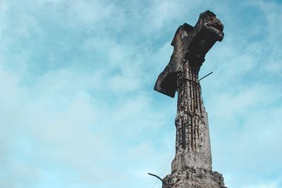 Low angle view of statue against sky