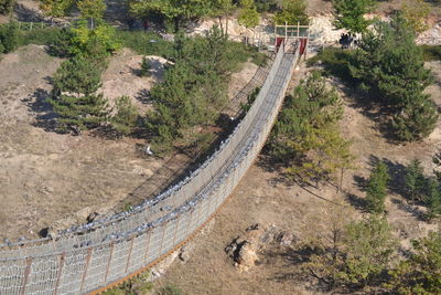 High angle view of highway amidst trees in city