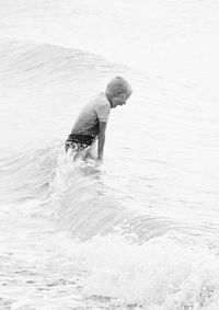 Boy enjoying sea waves