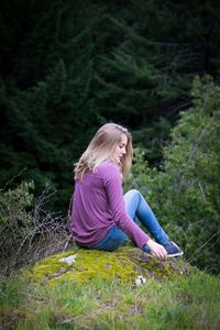 Woman sitting on grass