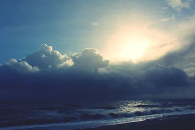 Scenic view of sea against cloudy sky