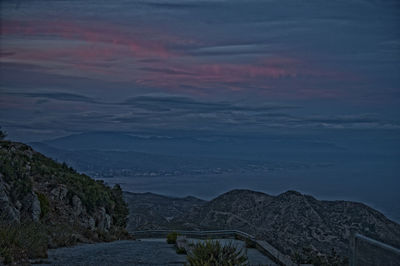 Scenic view of mountains against sky during sunset