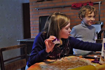 Cute girl eating food at restaurant