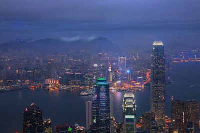 High angle view of city lit up at night