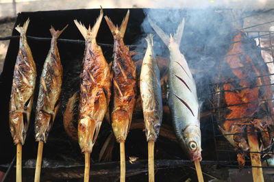 Close-up high angle view of fish on grill