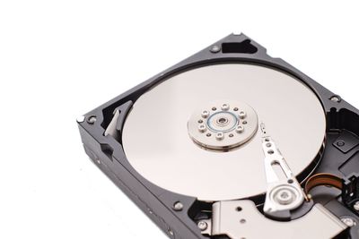 High angle view of hard drive against white background
