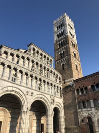 Low angle view of historical building against blue sky