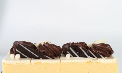 Close-up of chocolate cake against white background