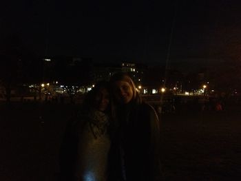 Woman standing at night