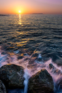 Scenic view of sea against sky during sunset