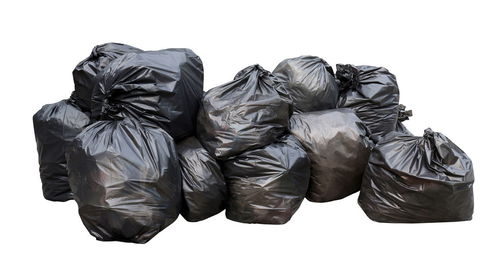 Close-up of garbage against white background