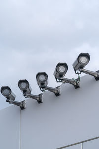 Low angle view of street light against sky