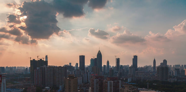 View of city against cloudy sky