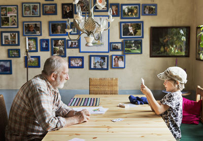 Grandfather and boy playing cards