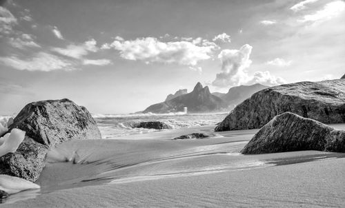 Panoramic view of sea and rocks against sky