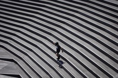 High angle view of woman walking on street