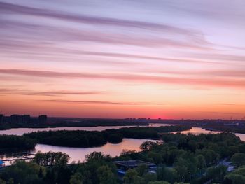 High angle view of river against sky at sunset