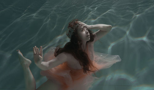 Woman swimming in pool