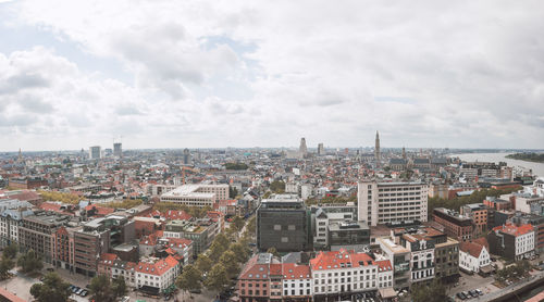 High angle view of city against cloudy sky