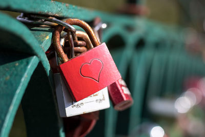 Close-up of love padlocks hanging on metal