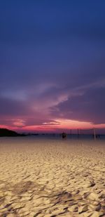 Scenic view of beach against sky during sunset