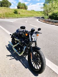 Close-up of motorcycle on street